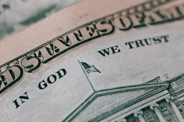 "In God We Trust" as written in a US Dollar