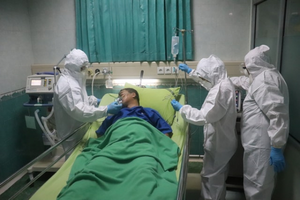 Man treated by nurses in hospital
