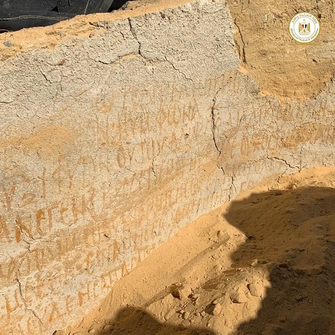 The fifth-century monastery's walls bearing "scribbles and symbols bearing Coptic inscriptions"