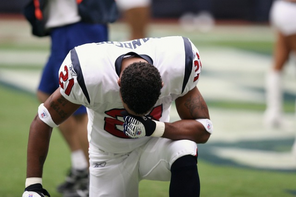 NFL Player Praying