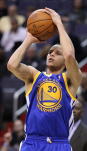 Stephen Curry Shoots Basketball During Match