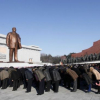 People bow down to Kim Il Sung and Kim Jong Il statue. It was built on the site of Jang Dae-hyun's church, a symbol of revival in Pyongyang