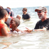People gather for Calvary Chapel Church’s annual outdoor baptism at Newport Beach’s Corona Del Mar State Beach on Saturday, September 12, 2020