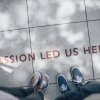 "Passion led us here" written on floor