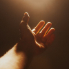 hand lifted up in prayer and worship