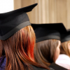 women wearing graduation hats and dresses