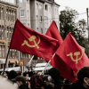 People waving communist flags on the streets