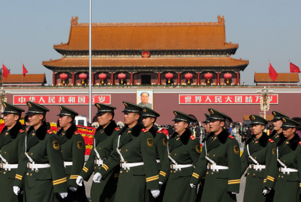 Members of China's People's Liberation Army (PLA) walk past the Tiananmen Gate in Beijing, China.