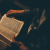Reading Bible in dim light