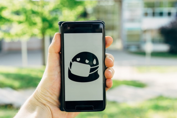 smartphone showing emoji wearing face mask