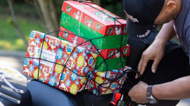 A biker bringing gifts for children at the #BikersWithBoxes event at the Billy Graham Library