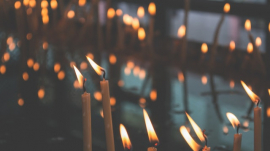 lit candles placed on a surface