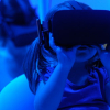 little girl using VR goggles