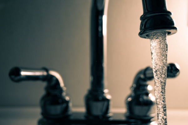 water flowing from an open faucet 