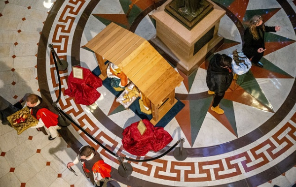 The group of Catholics praying as satanists install a blaphemous display at the Illinois State Capitol