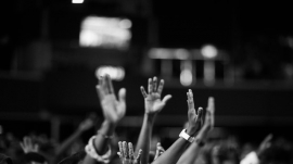 hands raised in worship in church