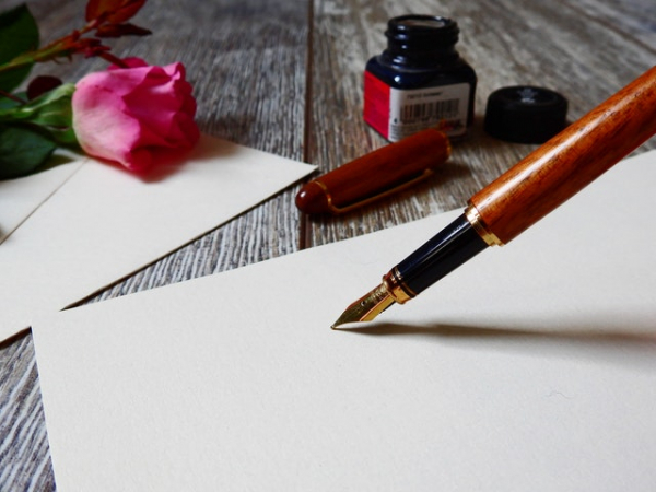 writing a love letter using a fountain pen