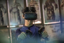kid playing games using Facebook&#039;s Oculus VR headset
