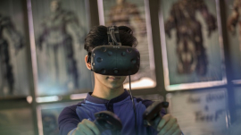 kid playing games using Facebook&#039;s Oculus VR headset