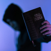 Person Holding Bible